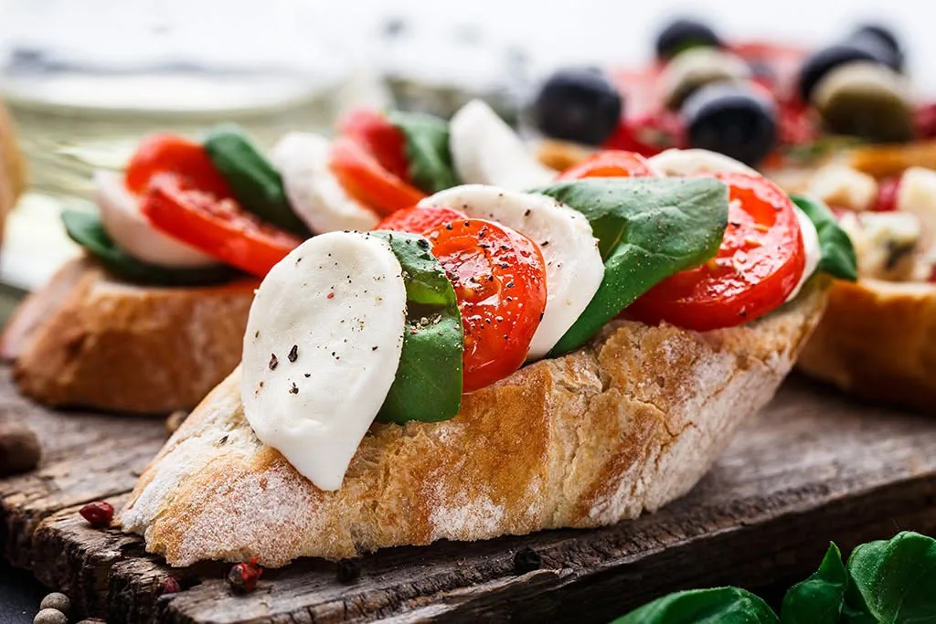 Close-up of tomato bruschetta on toasted crostini